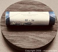 full view of sealed RCM special wrap roll, denomination text visible