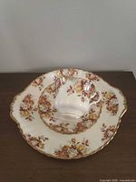 Teacup on saucer and dessert plate showing overall set
