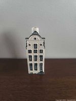 Front view of ceramic canal house bottle