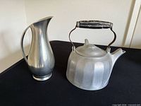 Front view of aluminum pitcher and teapot