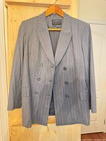Front view of blazer on hanger showing overall style
