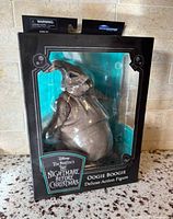 Front view of sealed box featuring Oogie Boogie figure