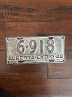 Front view of entire 1948 Alberta license plate showing number and condition