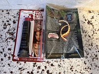 Blister-packed Fake Basic Blood tube and bagged Dental Distortions teeth side by side