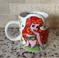 Front view showing Ariel artwork and sculpted rim