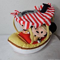 Front view of plush Jungle Cruise boat with Mickey and Minnie figures