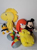 Group shot of all plush toys and rattles