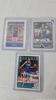 Front view of three LaMelo Ball rookie cards in holders