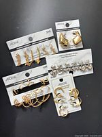 Group of five Ardene earring cards showing gold and silver styles