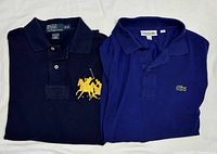 Both folded shirts showing front logos