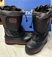 Front and side view of both boots beside original box