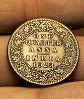 Reverse side showing ONE QUARTER ANNA INDIA 1929 within wreath