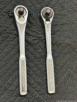 Two Craftsman 1/2" drive ratchets side by side