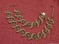 Necklace and bracelet laid flat showing overall design and length