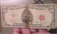 Full front view of the 1963 $5 note showing folds and serial number