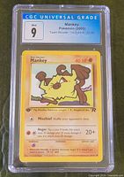 Front of CGC-slabbed Mankey card showing grade 9 label