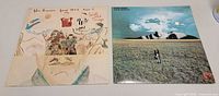 Both album covers side by side