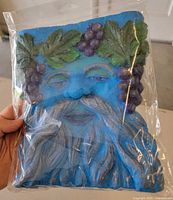 Front view of sealed paper-mache Green Man plaque