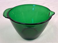 Side view of green glass batter bowl