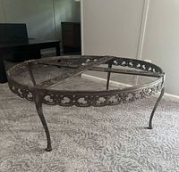 Metal coffee table frame with glass top in place