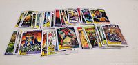 Fronts of Marvel Universe trading cards spread on table