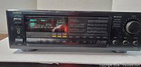 Front view of Onkyo TX-905 showing display, controls and knobs