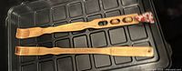 Pair of wooden back scratchers on tray