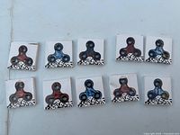 Ten boxed fidget spinners arranged on surface