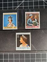 Front view of all three Jersey Silver Jubilee stamps 5p, 7p, 25p