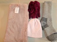 Group shot: faux-fur cowl, burgundy gloves, pink beanie, grey socks