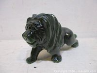 Front angled view of jade lion figurine