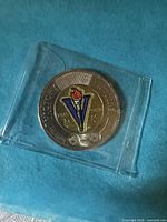 Obverse side showing coloured Victory V design