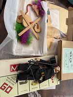 Monopoly box, wooden puppets, control bars visible