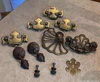 Full lot showing all drawer pulls, knobs and keyhole plate