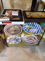 Overall view of platters, trays, placemats and coasters on shelving