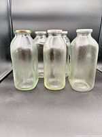 Front view of group of glass bottles standing upright