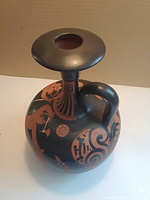 Oblique view showing full lekythos shape, lip, handle, and painted decoration
