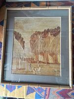 Full view of framed banana leaf collage showing entire artwork and frame