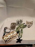 All six jewelry items laid out