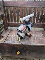 Angle view of complete pump showing housing, fittings and cord