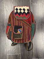 Front view showing kilim pattern, front pocket, main flap