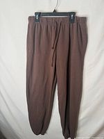 Front view of brown Aéropostale jogger sweatpants on hanger