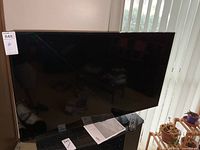 Front view of Samsung 48-inch TV on stand