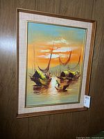 Full view of framed oil painting