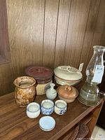 Group shot showing all pottery pieces and oil lamp