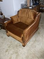 Front angled view of armchair with cushion