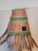 Full view of striped mohair wool scarf with fringe