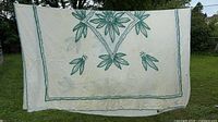 Full view of bed cover hanging, showing overall design