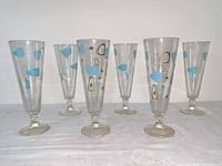 Six fluted Atomic Amoeba stemmed glasses front view