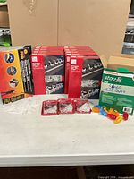 Front view of all boxes and bulb covers on table